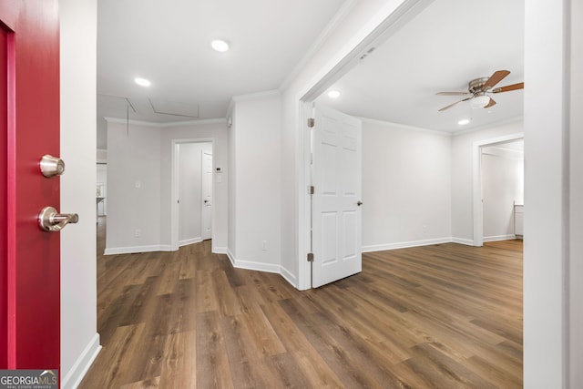 corridor featuring ornamental molding and dark hardwood / wood-style floors