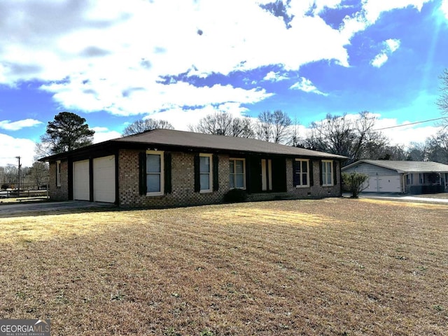 ranch-style house with a front yard and a garage