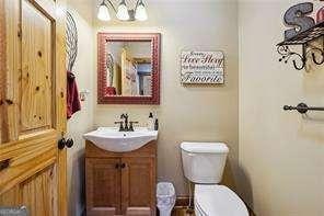 bathroom with toilet and vanity