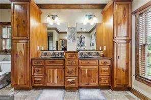 bathroom with crown molding, toilet, beam ceiling, and vanity