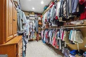 spacious closet with carpet floors