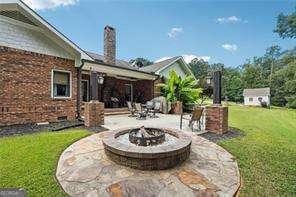 view of patio / terrace featuring a fire pit