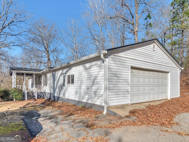 381 Martin Dairy Rd, Milner, GA 30257 - view of side of property with covered porch and an outdoor structure