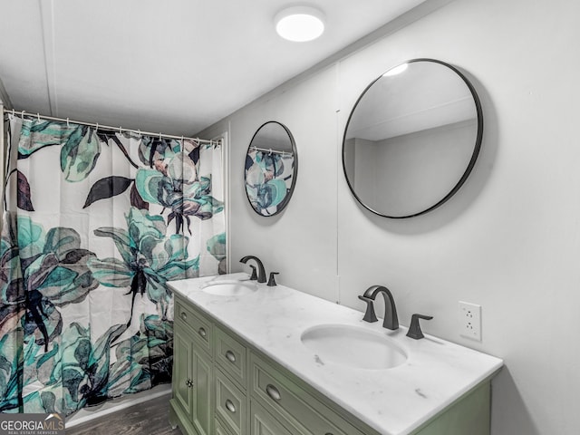 381 Martin Dairy Rd, Milner, GA 30257 - bathroom featuring double vanity, wood finished floors, and a shower with curtain