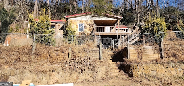 view of side of home featuring a deck