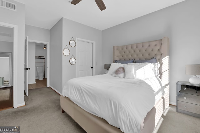 bedroom featuring ceiling fan and light colored carpet