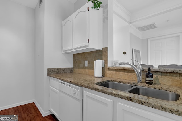 kitchen featuring sink, light stone counters, dishwasher, decorative backsplash, and white cabinets