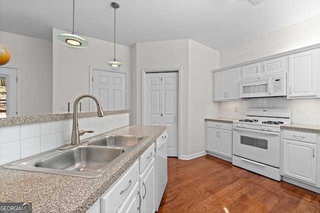 kitchen with hanging light fixtures, sink, backsplash, white cabinetry, and white appliances