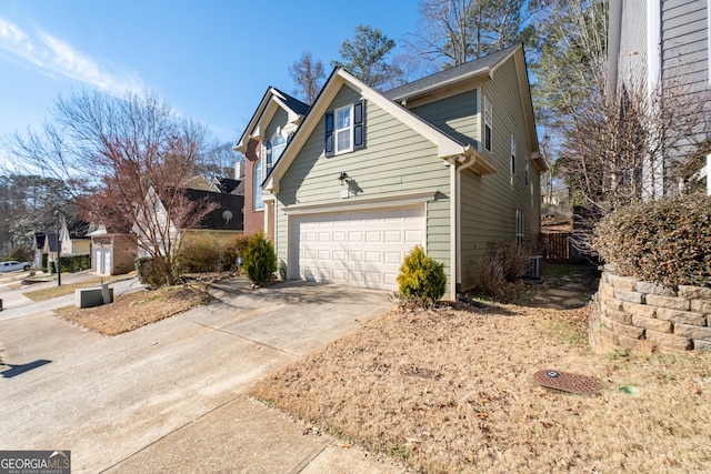 view of side of property with a garage