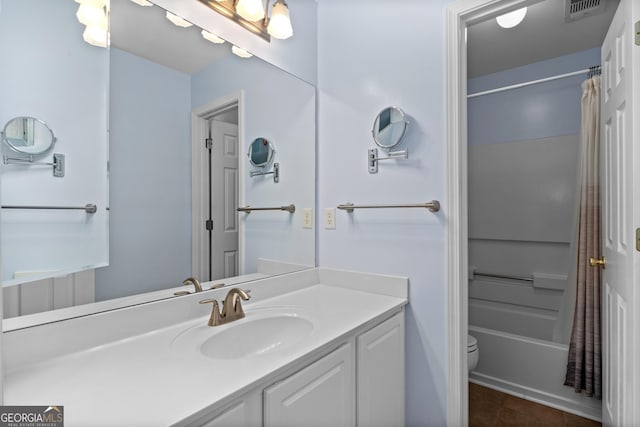 full bathroom featuring vanity, toilet, and shower / bath combo with shower curtain