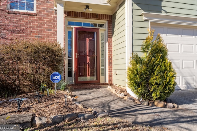 property entrance with a garage