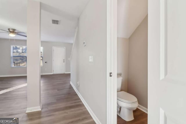 bathroom featuring ceiling fan, hardwood / wood-style floors, toilet, and lofted ceiling