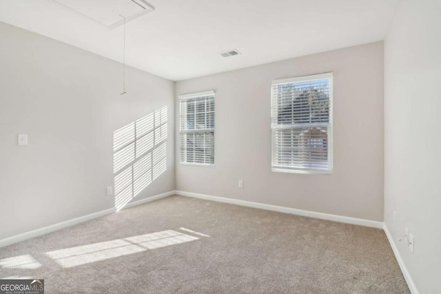 carpeted empty room featuring a healthy amount of sunlight