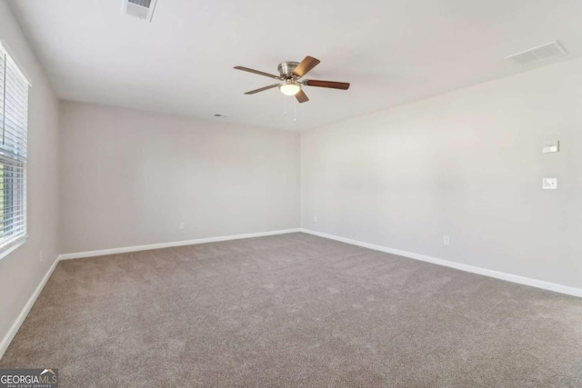 carpeted empty room with ceiling fan