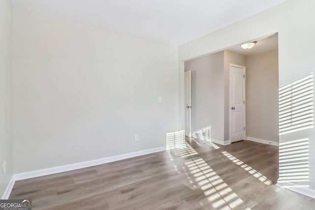 spare room featuring hardwood / wood-style flooring