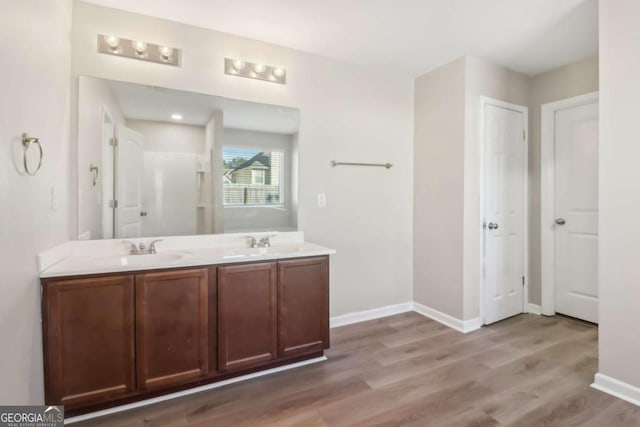 bathroom with vanity and wood-type flooring