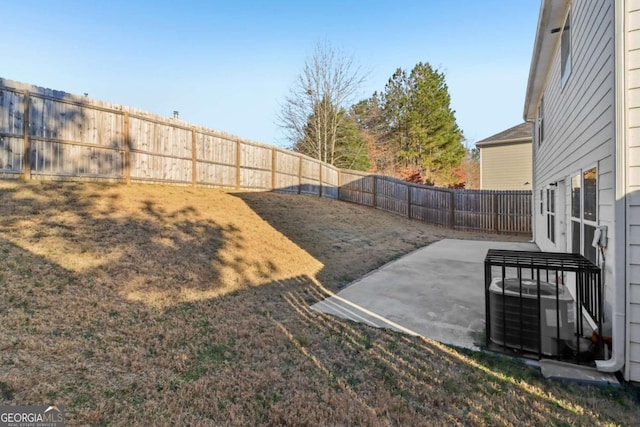 view of yard with cooling unit and a patio