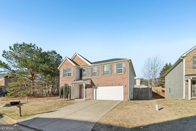 view of front facade featuring a garage and a front yard