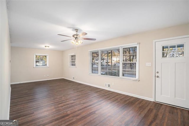 entryway featuring ceiling fan and dark wood-type flooring