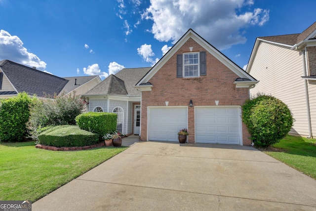 view of front property with a garage and a front lawn