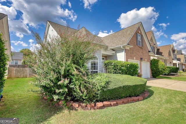 view of front facade featuring a front yard and a garage