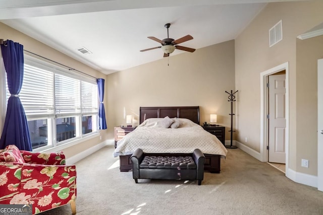 bedroom featuring ceiling fan, light colored carpet, and vaulted ceiling