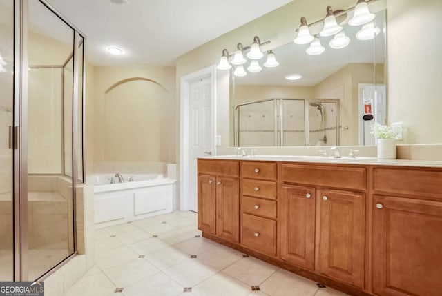 bathroom with vanity and independent shower and bath