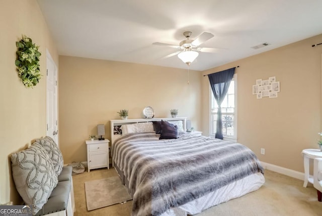 bedroom with light colored carpet and ceiling fan