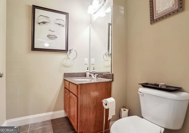 bathroom featuring vanity, toilet, and tile patterned floors