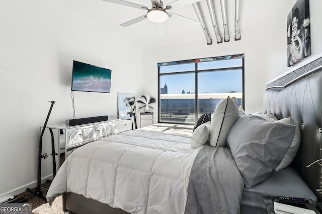 bedroom featuring ceiling fan, access to exterior, and carpet flooring