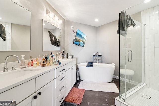 bathroom with tile patterned floors, vanity, and independent shower and bath