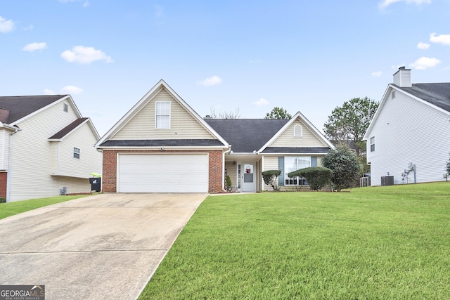 view of front of property with a garage, central AC, and a front yard