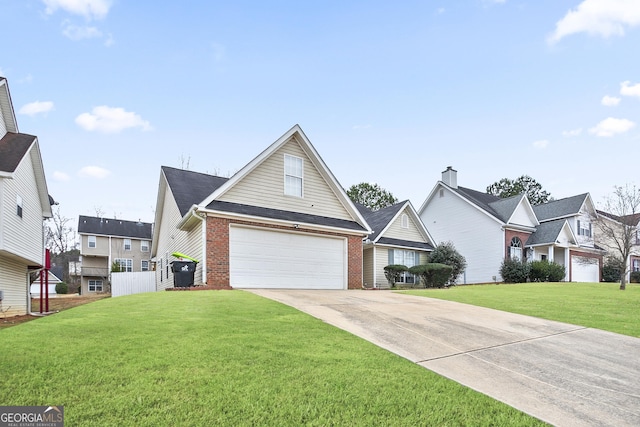 view of front of house with a garage and a front yard