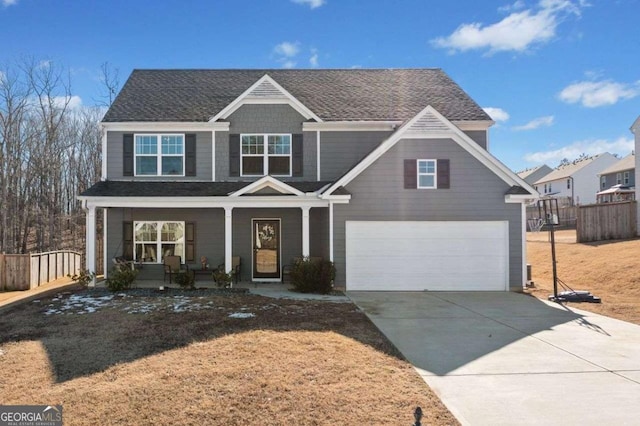 view of front facade featuring covered porch and a garage