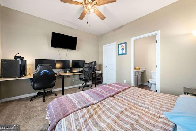 carpeted bedroom with connected bathroom and ceiling fan