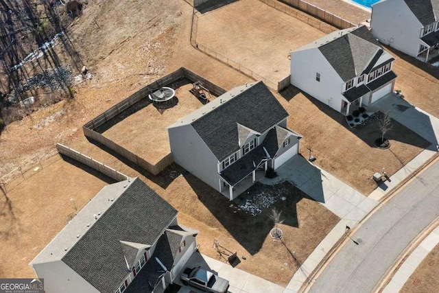 rear view of house featuring a fire pit and a patio