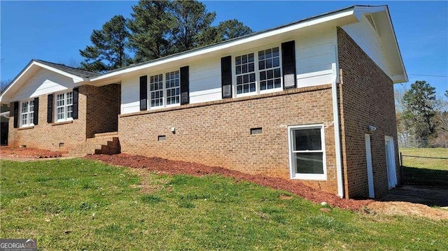 view of property exterior with a yard