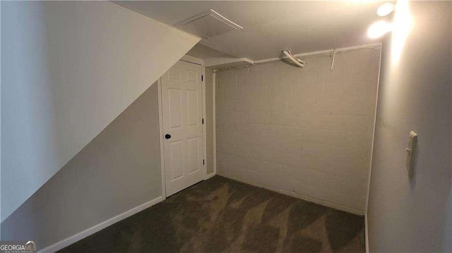 spacious closet featuring dark carpet