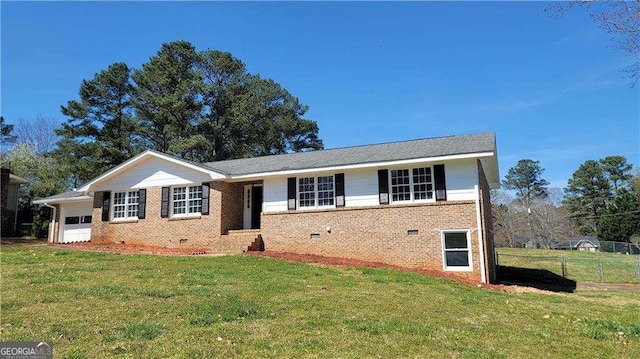 ranch-style house with a garage and a front yard