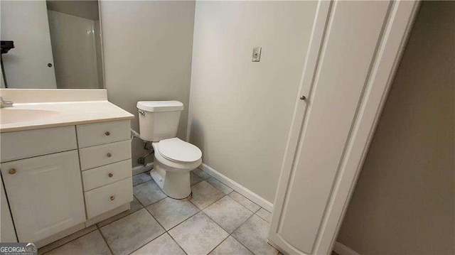 bathroom with toilet and vanity