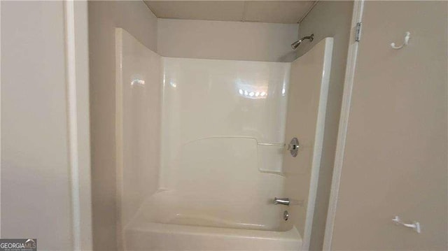 bathroom with shower / bathtub combination