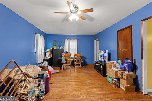 interior space with ceiling fan and light hardwood / wood-style flooring