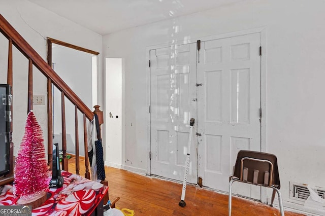 foyer entrance with hardwood / wood-style floors