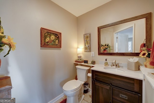 bathroom with tile patterned floors, vanity, and toilet