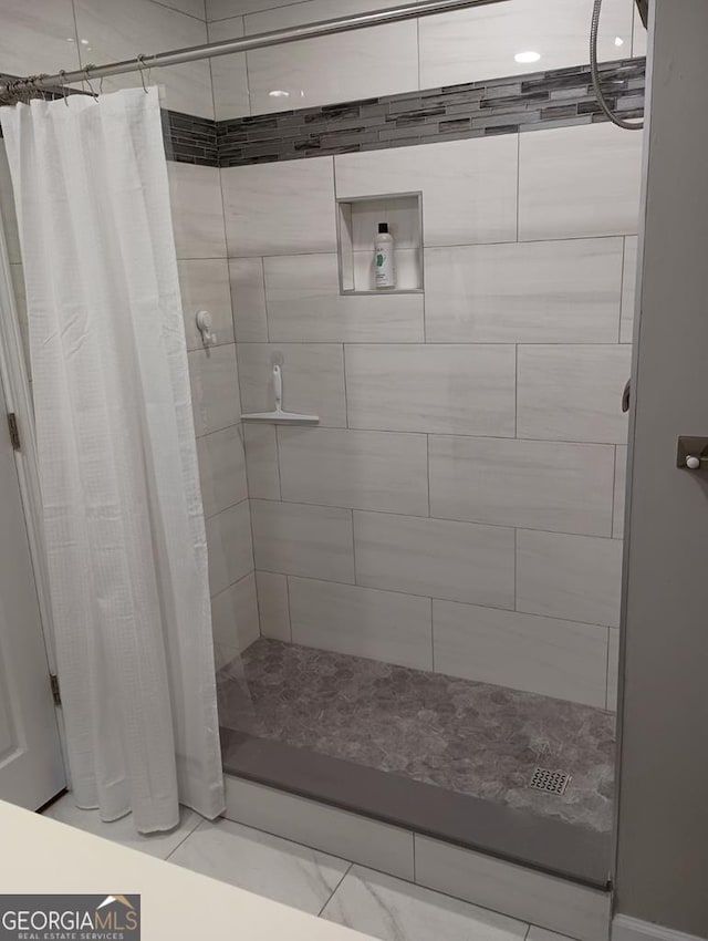 bathroom with a shower with shower curtain