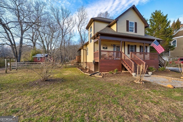 view of front of house featuring covered porch and a front yard