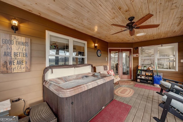 sunroom / solarium with wooden ceiling, a hot tub, and ceiling fan