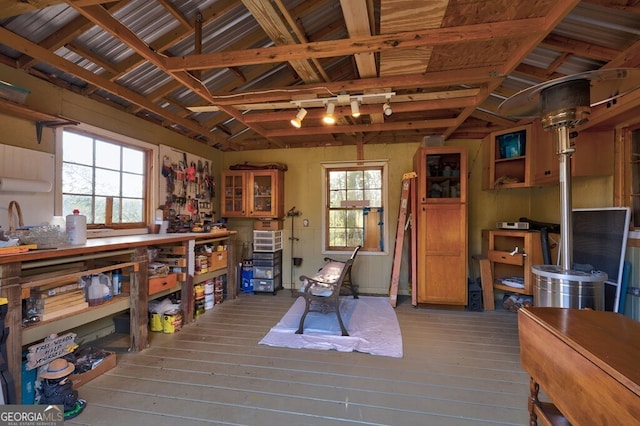 miscellaneous room with a wealth of natural light, hardwood / wood-style floors, and lofted ceiling