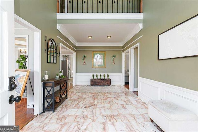 entryway featuring ornamental molding