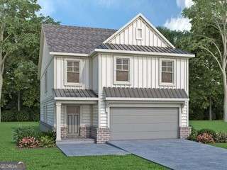 view of front of property featuring a garage and a front yard